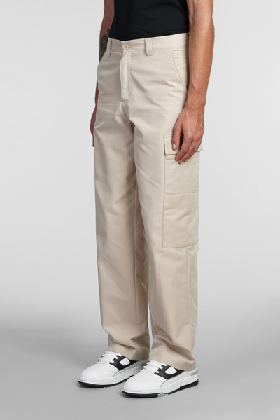 Shop Axel Arigato Pants In Beige Cotton