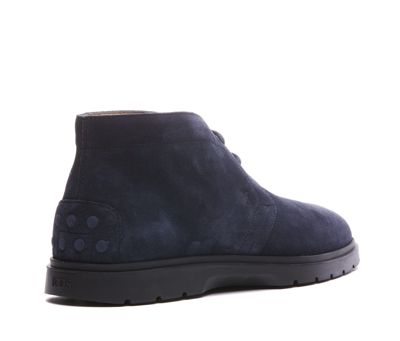 Shop Tod's Suede Lace Up Boots In Blue