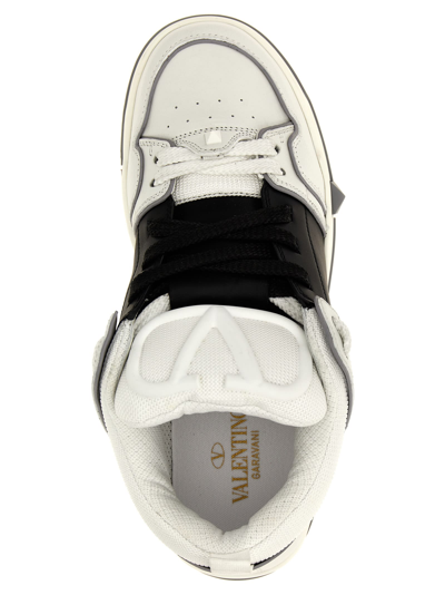 Shop Valentino Garavani Open Skate Sneakers In White/black