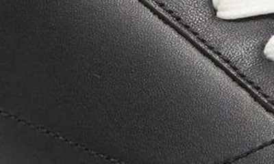 Shop Official Program Clean Cupsole Camo Sneaker In Black/ Gold