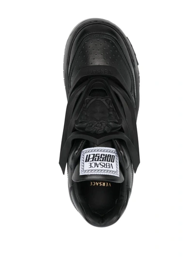 Shop Versace Sneakers In Black