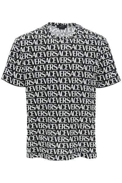 Shop Versace All Over Logo T Shirt In Black, White