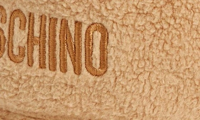 Shop Moschino Logo Embroidered Teddy Fleece Bucket Hat In 1018 Fantasy Print Beige