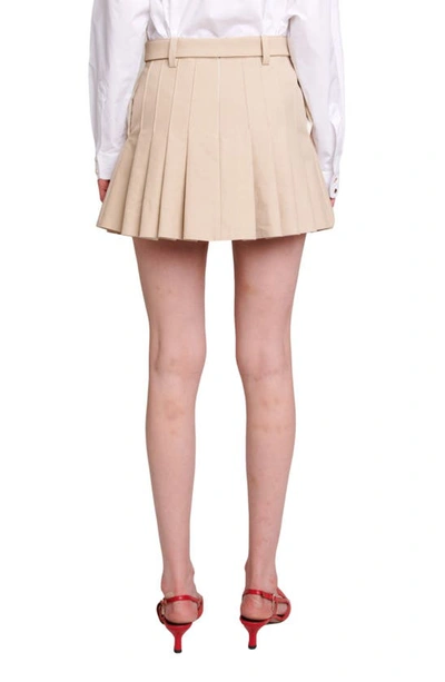 Shop Maje Belted Pleated Miniskirt In Beige