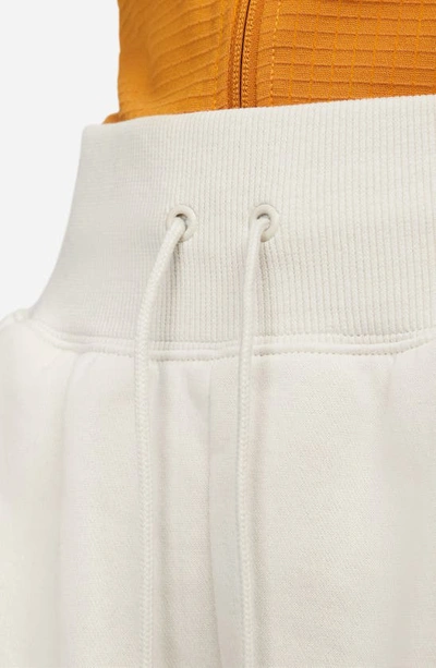 Shop Nike Phoenix Fleece Knit Shorts In Ltowbr/sail