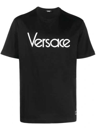 Shop Versace Logo-embroidered T-shirt In Black