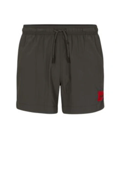Shop Hugo Quick-dry Swim Shorts With Red Logo Label In Dark Grey