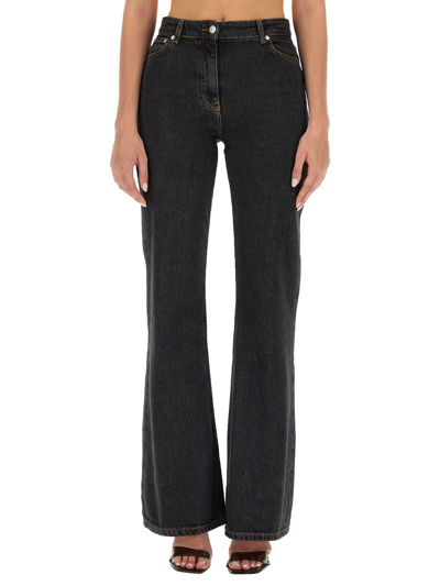 Shop Moschino Jeans Jeans Bootcut In Black