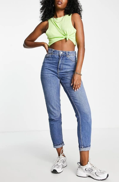 Shop Topshop High Waist Tapered Mom Jeans In Mid Blue