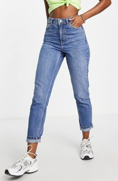Shop Topshop High Waist Tapered Mom Jeans In Mid Blue