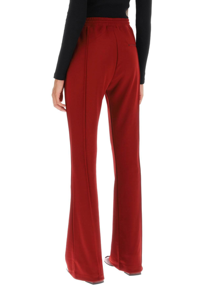 Shop Courrèges Flared Track Pants In Red