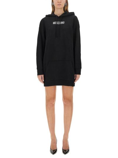 Shop Moschino Logo Detailed Sweatshirt Dress In Black