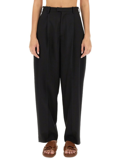 Shop Marni Tapered Leg Trousers In Black