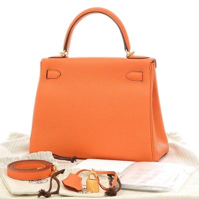 Shop Hermes Hermès Kelly 25 Orange Leather Handbag ()