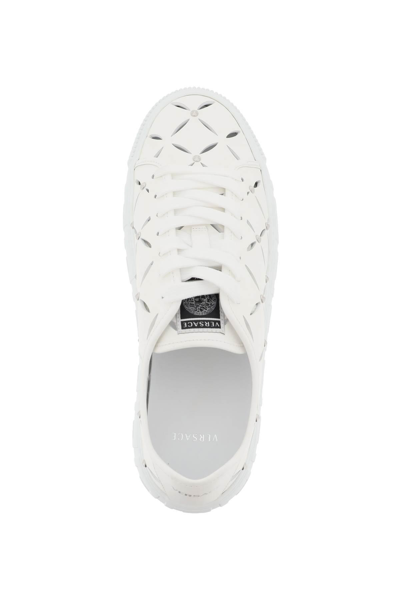Shop Versace Greca Cut-out Sneakers In White