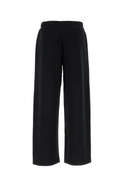 Shop Palm Angels Pants In Blackred