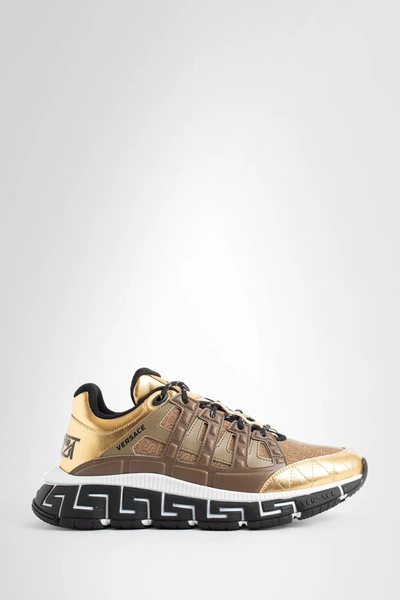 Shop Versace Man Gold Sneakers