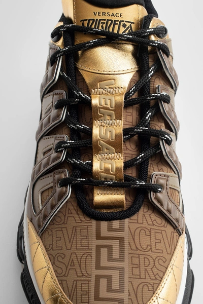 Shop Versace Man Gold Sneakers