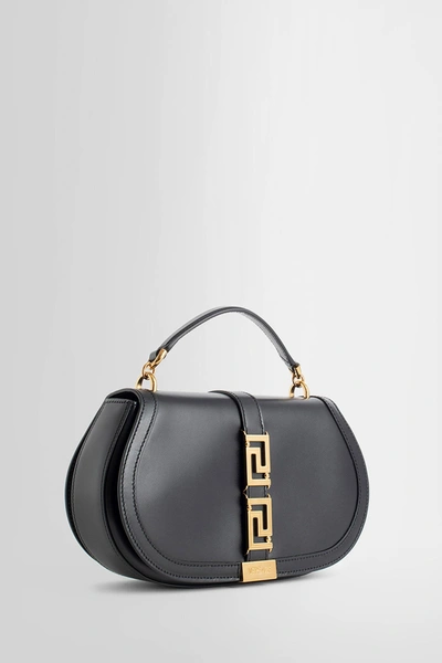 Shop Versace Woman Black Top Handle Bags