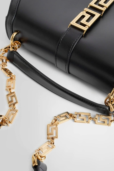 Shop Versace Woman Black Top Handle Bags