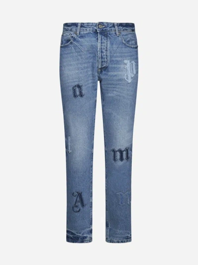 Shop Palm Angels Logo Patches Jeans In Light Blue