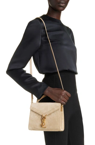 Shop Saint Laurent Mini Cassandra Leather Top Handle Bag In Matt Gold