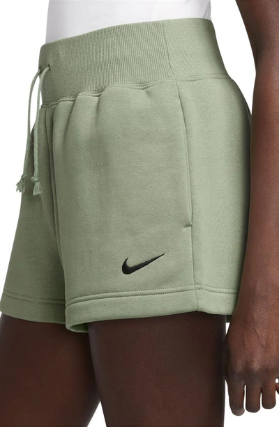 Shop Nike Phoenix Fleece Knit Shorts In Oil Green/ Black