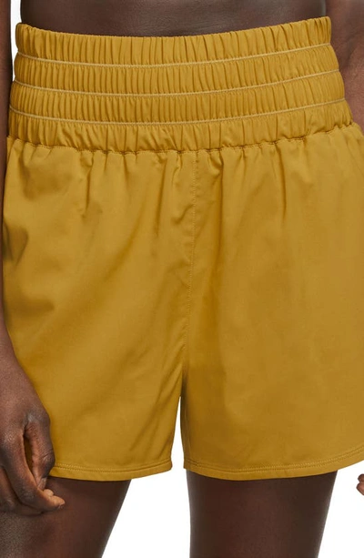 Shop Nike Dri-fit Ultrahigh Waist 3-inch Brief Lined Shorts In Bronzine/ Reflective Silver