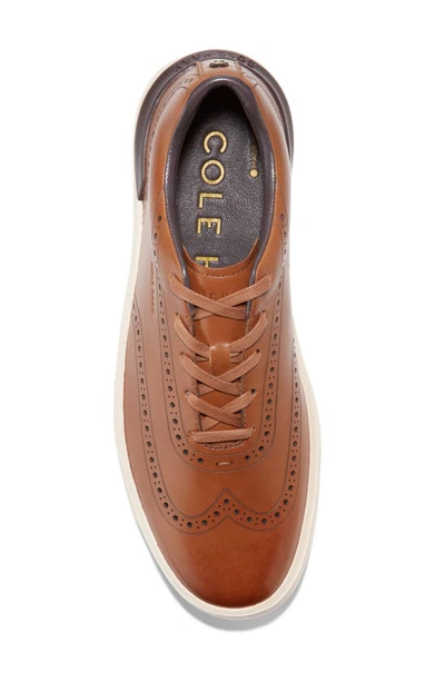 Shop Cole Haan Grandpro Crew Wingtip Sneaker In Ch British Tan/ Birch
