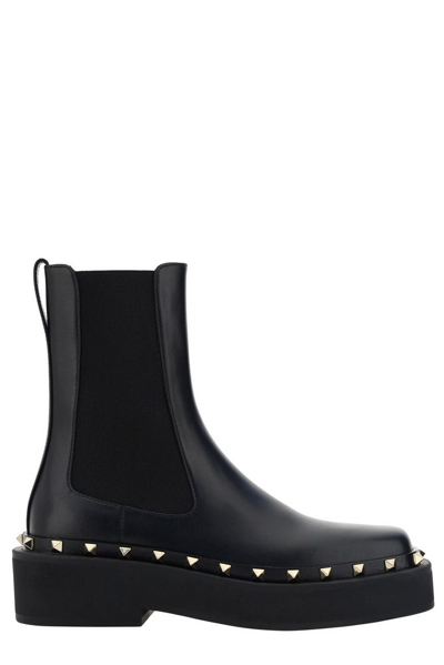 Shop Valentino Garavani Rockstud Round Toe Boots In Black