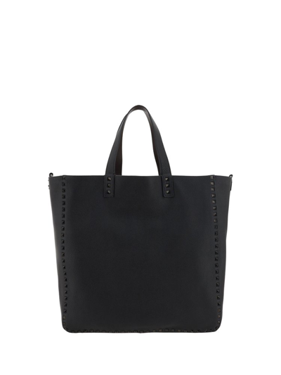 Shop Valentino Garavani Rockstud Top Handle Bag In Black
