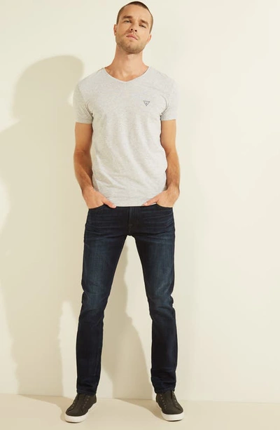 Shop Guess Slim Tapered Straight Leg Jeans In Ringer Wash Indigo