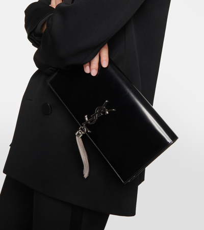 Shop Saint Laurent Kate Tasseled Leather Clutch In Black