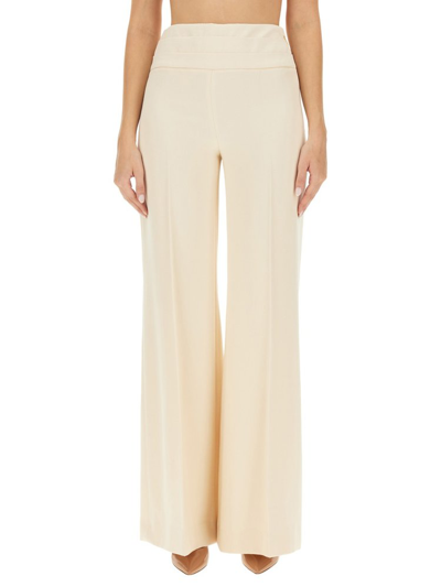 Shop Moschino Wide Leg Pants In White