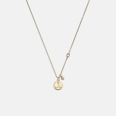 Shop Coach Outlet Pisces Coin Pendant Necklace In Yellow