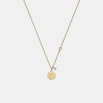 Shop Coach Outlet Aquarius Coin Pendant Necklace In Yellow