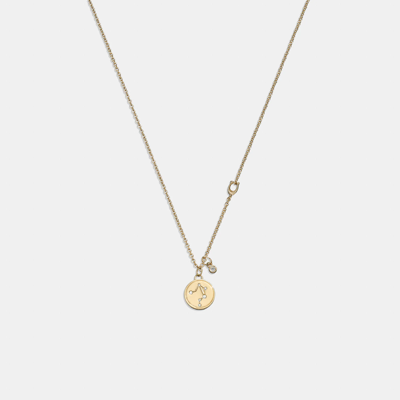 Shop Coach Outlet Libra Coin Pendant Necklace In Yellow