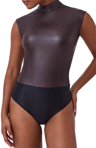 Shop Spanx Mock Neck Faux Leather Thong Bodysuit In Cherry Chocolate