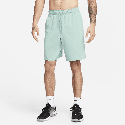 Shop Nike Men's Unlimited Dri-fit 9" Unlined Versatile Shorts In Green