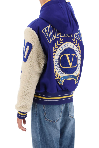 Shop Valentino Varsity Bomber Jacket With Shearling Sleeves In Blue,white