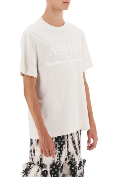Shop Amiri T-shirt With Rubberized Logo Print In Beige