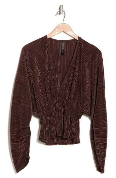 Shop Renee C Plissé Long Sleeve Peplum Top In Brown