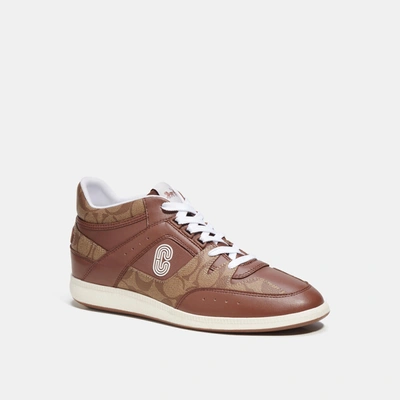 Shop Coach Outlet Mid Top Sneaker In Signature Canvas In Beige