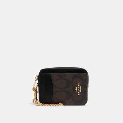 Shop Coach Outlet Zip Card Case In Signature Canvas In Brown