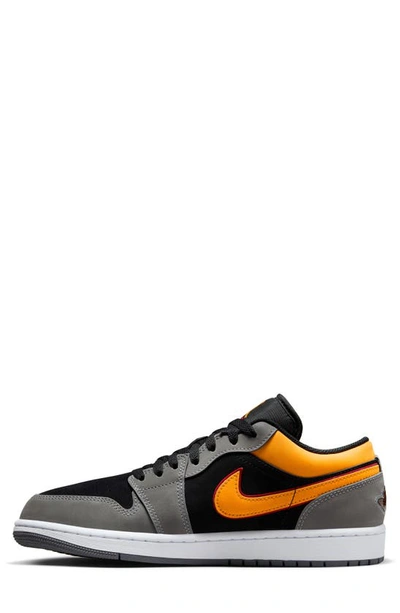 Shop Jordan Air  1 Low Sneaker In Black/ Vivid Orange/ Graphite