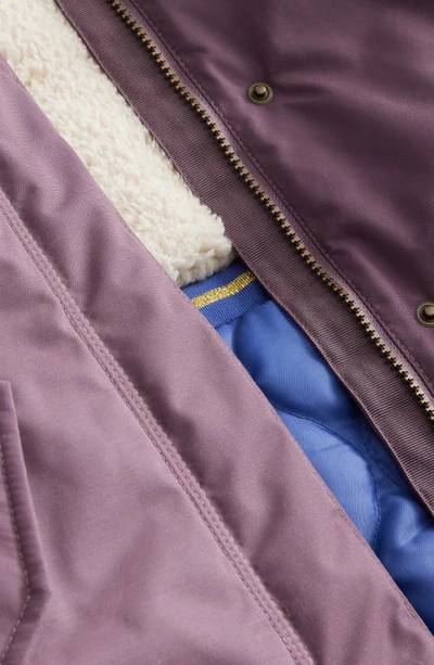 Shop Mini Boden Kids' Authentic High Pile Fleece Lined Parka With Faux Fur Trim In Misty Lavender
