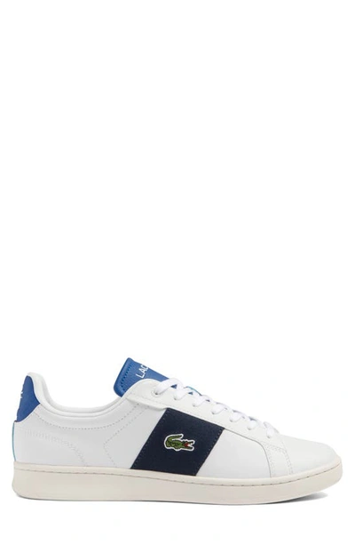 Shop Lacoste Carnaby Pro Sneaker In White/ Dark Blue