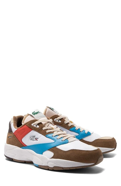 Shop Lacoste Storm 96 Low Leather Sneaker In Brown/ Blue