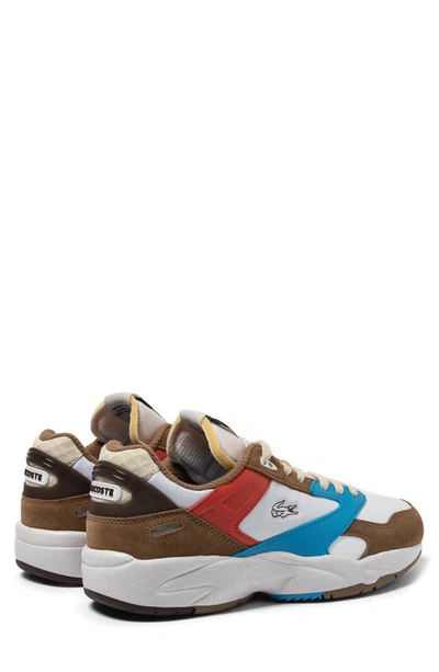 Shop Lacoste Storm 96 Low Leather Sneaker In Brown/ Blue