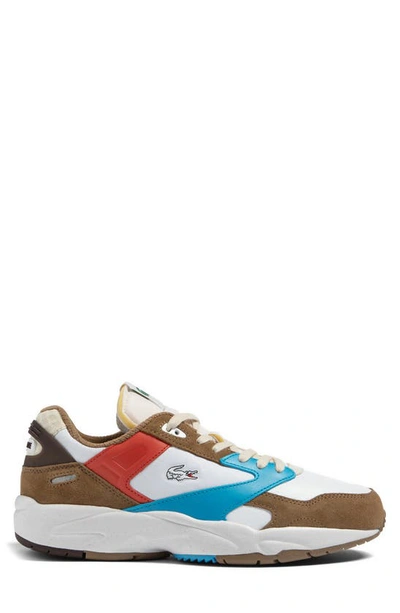 Shop Lacoste Storm 96 Low Leather Sneaker In Brown/ Blue